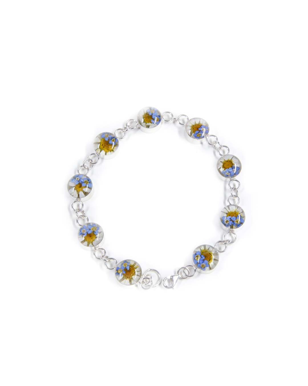 A sterling silver bracelet featuring real forget me not and daisy flowers as the main components, with a chain of silver links.