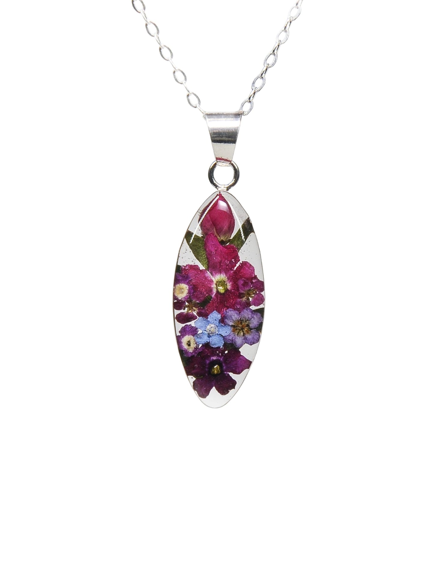 A sterling silver marquise pendant necklace with a mix of real rosebuds and other flowers arranged within the pendant, displayed on a silver chain.