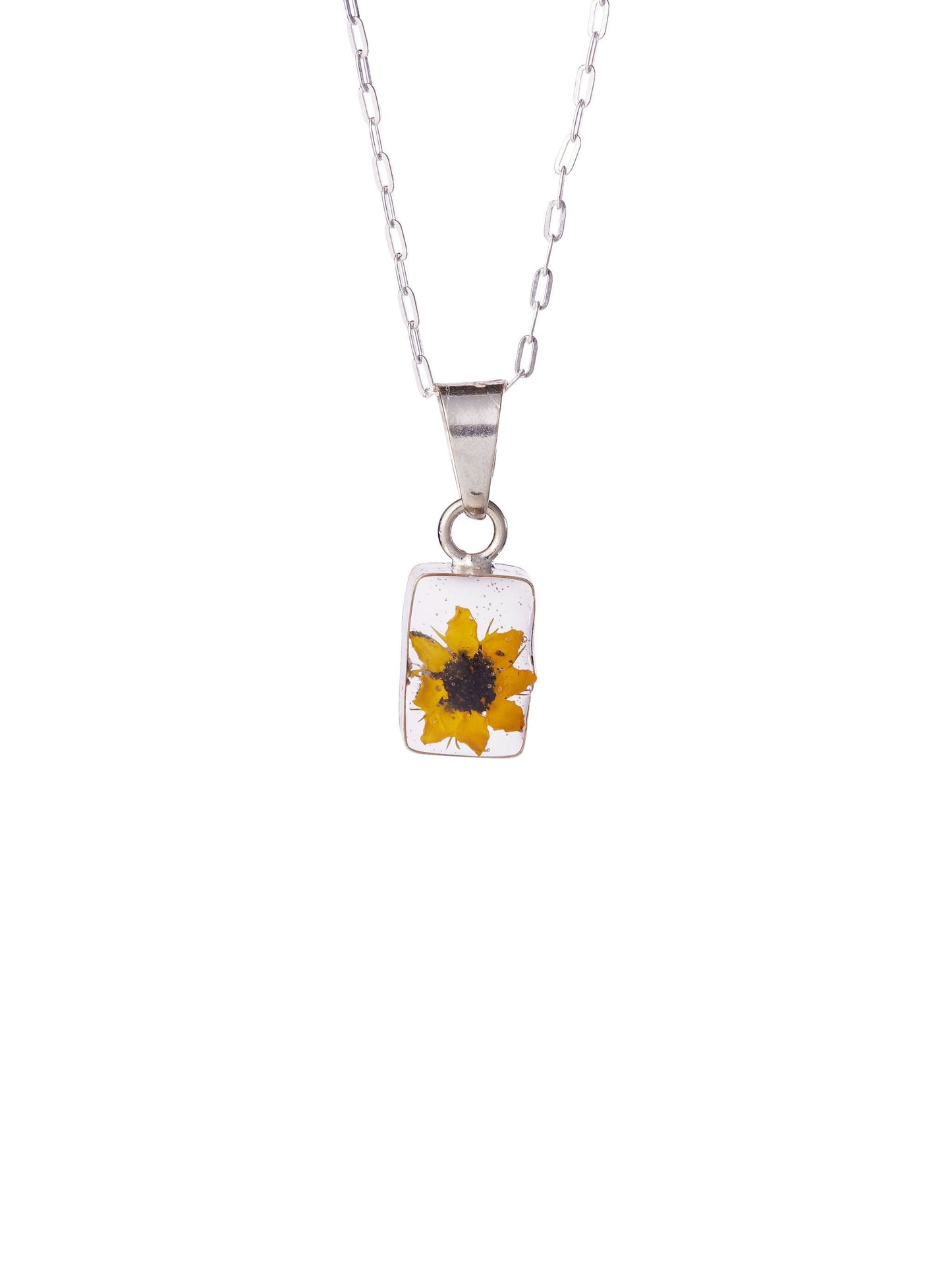 A sterling silver necklace with a small rectangular pendant containing a real sunflower, suspended on a chain.