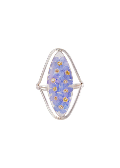 A sterling silver marquise ring with a medallion of forget me not flowers set within it.