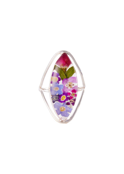 A sterling silver marquise-shaped ring with a medallion of rosebuds and mixed flowers set in clear resin.